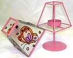 Lovely pink color table lamp style candle holder with painted flying butterfly figure on the cover