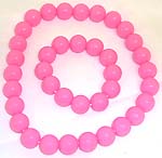 Multi rounded pink color plastic beads forming stretchy fashion necklace and bracelet set