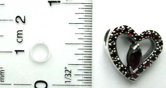 Multi mini rounded red garnet stone embedded cut-out heart shape pattern sterling silver pendant with an olive shap garnet stone in middle