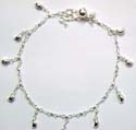 Sterling silver anklet with multi mini moon pattern and a mini bell attached on 