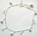 Sterling silver anklet with multi mini bells and 'S' in circle pattern hanging along