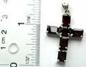 4 retangular and 1 rounded garnet stone forming cross pattern sterling silver pendant
