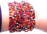 Assorted color beaded multi strings forming fashion bracelet with button end