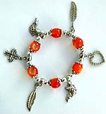 Orange beaded strecthy charm bracelet with cross, leaf fish and heart pattern 