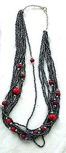 Tibetan style, tribe multi mini black beaded strings fashion necklace embedded with bigger red bead along the strings