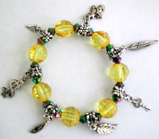 Multi yellow facet beads and silver beaded fashion charm stretchy bracelet with assorted design figure, leaf, cross, triangle, key and dollar sign