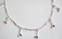 Dolphin pattern sterling silver anklet with twisted strips connected and a mini bell attached at the end