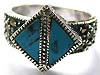 Multi marcasites embedded sterling silver ring holding 2 triangular turquoise stone at center