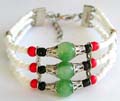 Fashion beaded bracelet with silver stripped triple white beaded strings holding 3 mini red, black and large silver capped green color beads at center