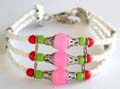 Tibetan fashion bracelet with silver stip triple white beaded strings holding 3 mini red, green and large silver capped pink color beads at center