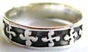 Black 925. sterling silver ring with multi carved-out mini flower pattern decor around