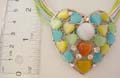 Multi color strings with heart shape cat eyes embedded heart shape pendant 