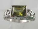 High polish rhodium ring with olive cz stone in millde design with double rows clear cz embedded on both sides