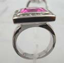 Fashion pink cz set in centre ring with multi mini clear cz around, rhodium plated in brass base