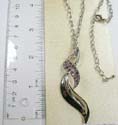 Fashion necklace holding double wavy line pattern with multi mini purple cz stone embedded on top. Lobster claw clasp