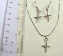 Fashion jewelry set, silver plated necklace holding cross pendant with a rounded clear cz at center paired with same design fish hook earring. Spring ring clasp