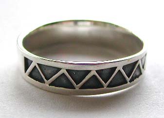 Black ring made of solid 925. sterling silver with carved-out triangular wave line