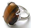 Fashion ring with an oval shape genuine tiger eye stone inlaid at center, silver plated thin band design