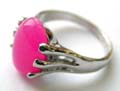 Fashion ring in finger shape pattern design holding a genuine oval shape pinkish stone at center