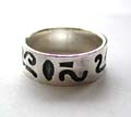 Sterling silver ring in wide band design with black tattoo wave line pattern decor 