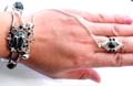 Fashion slave bangle bracelet-ring with imitation black stone inlaid flower pattern design, mini bell decor