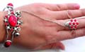 Fashion slave bangle bracelet-ring with imitation red stone inlaid flower pattern design, mini bell decor