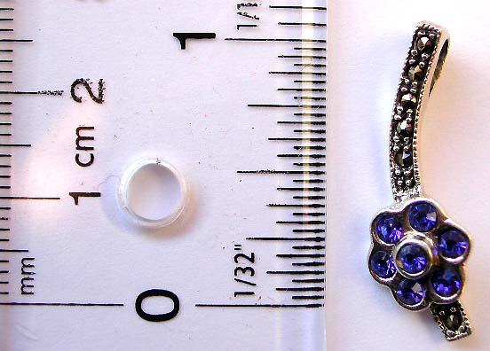 Sterling silver pendant with mini blue cz stone embedded flower on marcasite stone inlay curve strip pattern design    