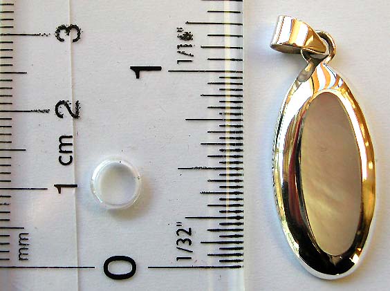 Wide edge elliptical shape sterling silver pendant with a white mother of pearl seashell inlaid    