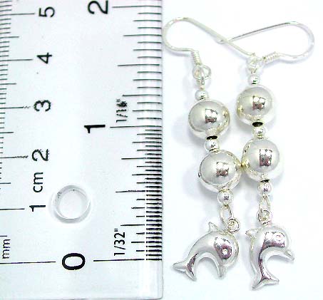 Sterling silver earring with 2 large and 3 mini spinning beads beaded strip holding a dolphin pattern on bottom, fish hook back     