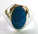 Sterling silver ring with an ellicptical shape genuine blue turquoise stone inlay at center