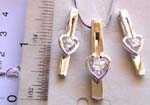 Fashion jewelry set, snake chain necklace holding a rounded clear cz stone embedded heart love pattern on long strip pendant at center, same design stud earring set 