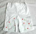Denim or white color kids long jean pants; sewn butterfly flower along bottom legs