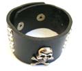 Fashion bracelet with multi rounded shiny beads and 2 star button decor on black wide imitation leather band design,a skull pattern set on center, double botton end to close