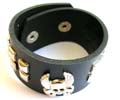 Fashion bracelet in black wide imitation leather band design with multi mini square button decor along and a evil skull pattern at center, double botton end for adjustable closure