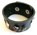 Fashion bracelet in black wide imitation leather band design with multi curvy button decor along and a spider pattern at center, double botton end for adjustable closure