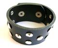 Fashion bracelet in black wide imitation leather band design with multi mini square and rounded button decor along, double botton end for adjustable closure