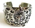 Fashion bangle in plain wide band design with fox pattern decor at center