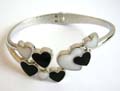 Fashion bangle bracelet with multi black and white heart love pattern decor at center