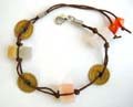 Fashion bracelet in double string design with 3 coins and 2 natural stone inlaid