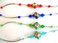 Fashion bracelet in curve strip design with diamond shape arylic beads holding a diamond shape tibetan flower bead at center, assorted color randomly pick 