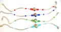 Fashion bracelet in curve strip design with diamond shape arylic beads holding a diamond shape tibetan flower bead at center, assorted color randomly pick 