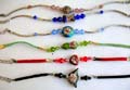 Fashion bracelet with assorted color imitation leather band or curved strip holding assorted shape handmade enamel cloisonne   flower bead at center, assorted color and design randomly pick 