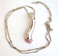 Fashion necklace with beaded chain holding a multi mini pinkish cz bottom embedded curve metal pendnat at center