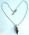 Fashion necklace with beaded chain holding a multi mini purple cz embedded long olive shape metal pendant at center 