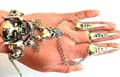 Fashion slave bracelet with double evil monster pattern design and a jiggle bell end decor, 3 chain in sharp nail rings fashion 