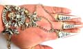 Fashion slave bracelet in double skull plaque pattern designholding multi mini jiggle bells decor and 3 chain in sharp nail rings fashion 