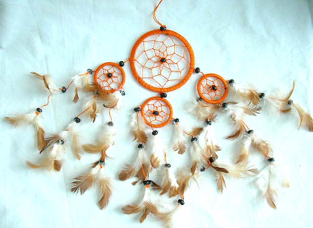Southwestern gift wholesale dream catcher, one large catcher with 3 mini ones holding multi beaded feather on bottom