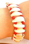 Multi mini white seashell froming a fashion bracelet with assorted color rope design