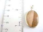 925.stamped sterling silver pendant in oval shape with brown gemstone inlaid