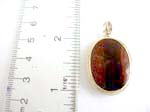 925.stamped sterling silver pendant in oval shape with red agate stone inlaid